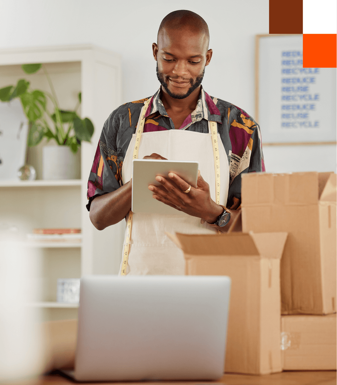 A man using a tablet to manage an online business
