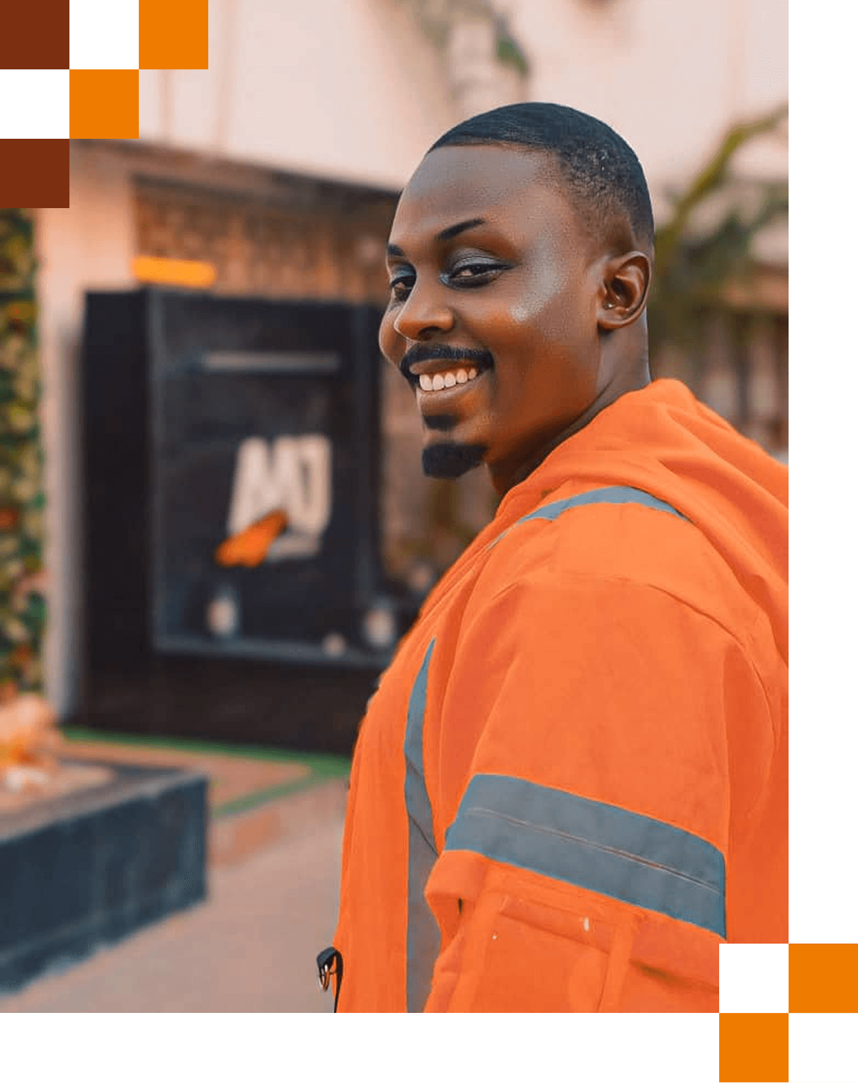 A smiling man in an AAJ franchise jacket