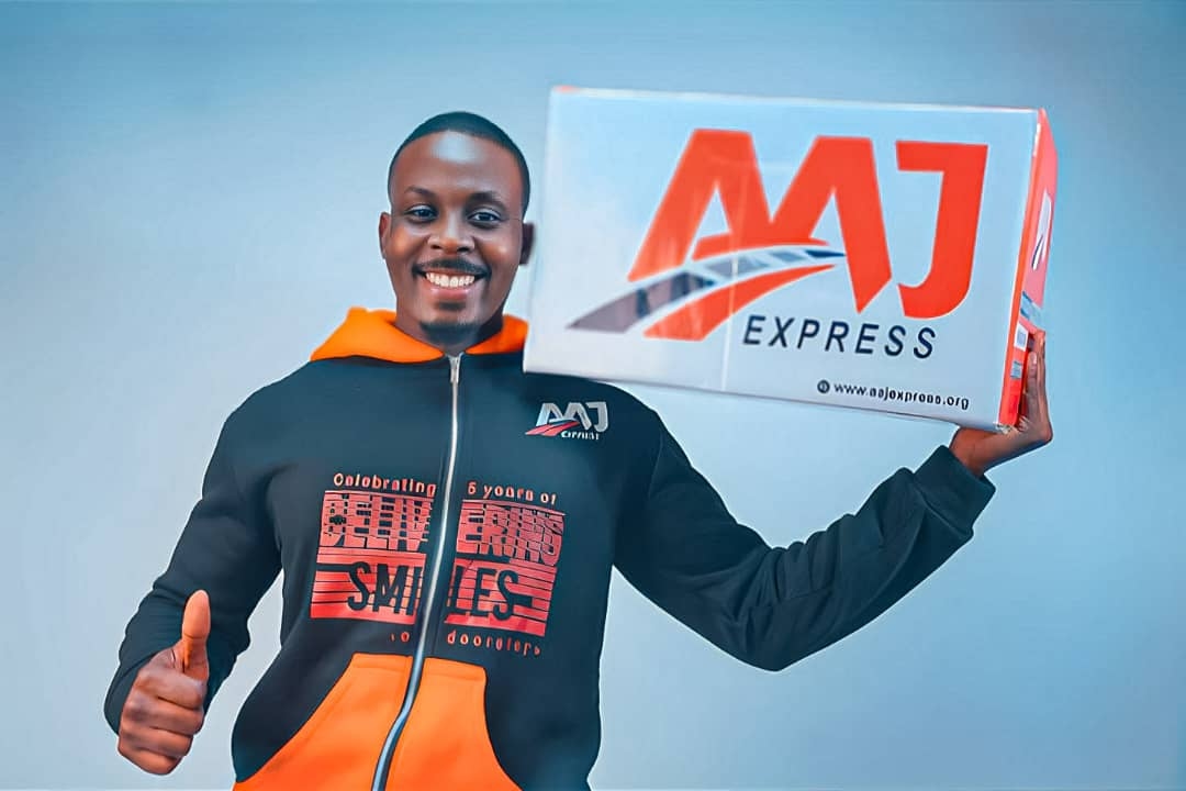 A man holding an AAJ Express package